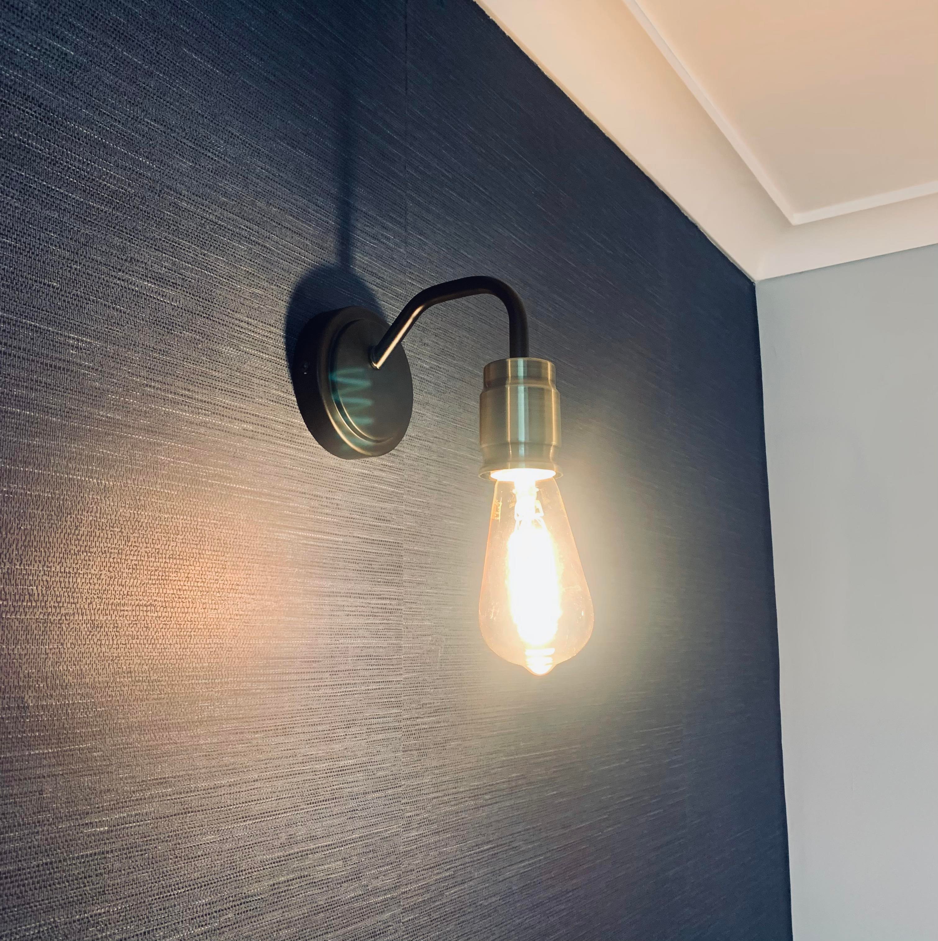 A wall light installed by JJB Electrical